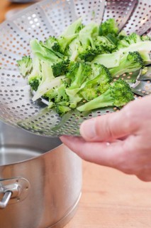 Broccoli in a steamer utensil