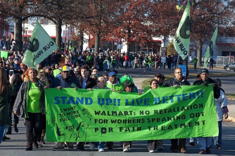 Walmart workers rally with supporters outside one of the company's stores on Black Friday