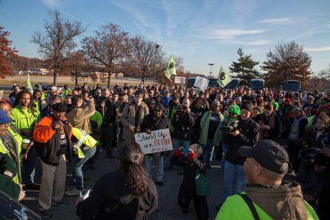 Walmart workers rally with supporters outside one of the company's stores on Black Friday