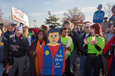 Walmart workers rally with supporters outside one of the company's stores on Black Friday
