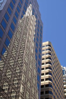 Reflection of the Transamerica Pyramid skyscraper in the East West Bank high-rise