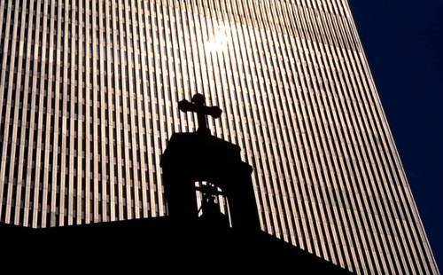 The St. Nicholas Greek Orthodox Church in front of a tower of the former World Trade Center or WTC