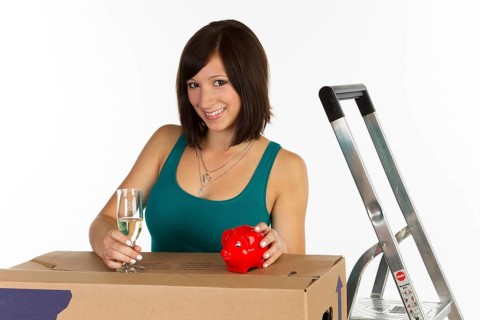 Young woman with a moving box