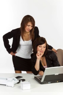Two young women in an office