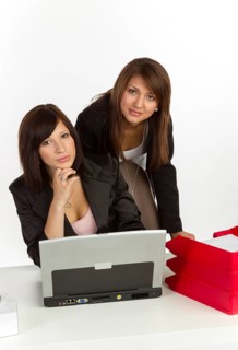 Two young women in an office