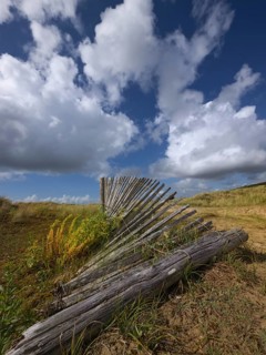 Damaged dune protection fence in the Bay of Douarnenez
