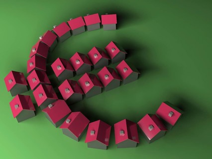 Small model houses forming the Euro symbol