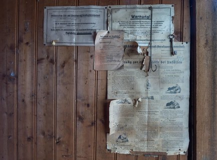 Information from the employers' liability insurance association on a wooden wall