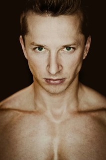 Young man with a muscular upper body