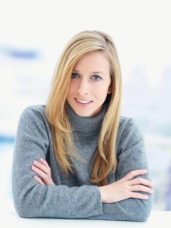 Young woman wearing a gray sweater