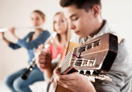 Teenagers making music together