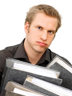 Businessman carrying ring binders