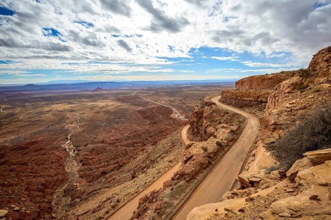 Moki Dugway leads in serpentines through the steep face of the Cedar Mesa