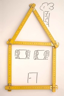 Folding rule in the shape of a house