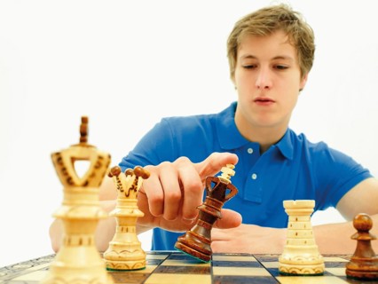 Young man playing chess