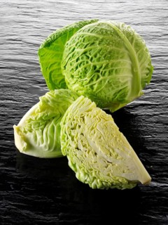 Whole and cut Savoy cabbage