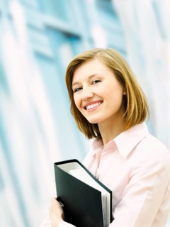 Businesswoman holding a ring binder