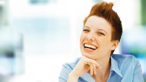 Businesswoman with a punk hairstyle in an office
