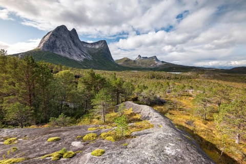 Distinctive mountain peak Stortinden in autumn landscape