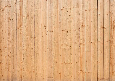 Natural colored wooden wall of rough boards