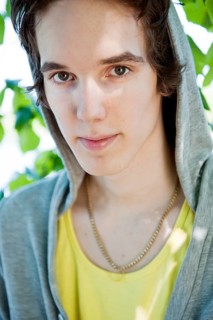 Portrait of young man wearing a hodded sweatshirt