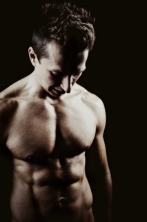 Young man with a muscular upper body
