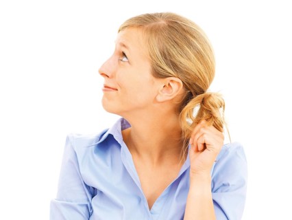 Young woman looking bashful