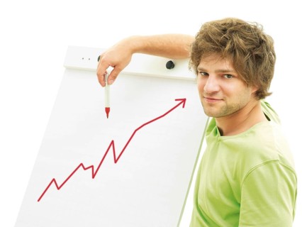 Man standing in front of a flip chart with a rising rate