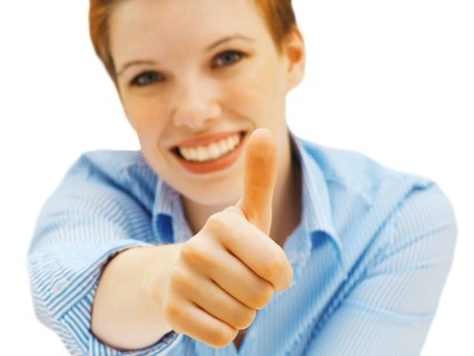 Businesswoman making a thumbs up gesture
