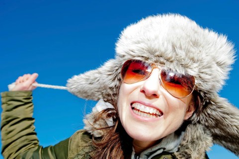 Happy woman wearing winter clothes