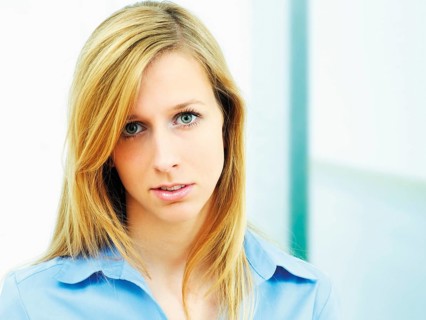 Young woman wearing a blue blouse