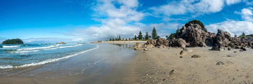 Sandy beach beach of Mount Manganui with island Motiti Island