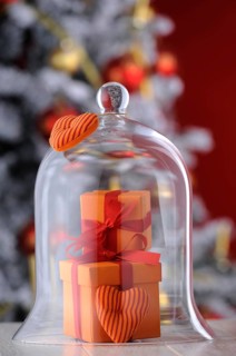 Gifts under a glass bell with Christmas ambience