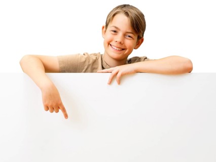 Schoolboy behind a white board