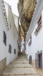 Narrow alley with rock wall