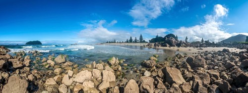 Sandy beach beach of Mount Manganui with island Motiti Island