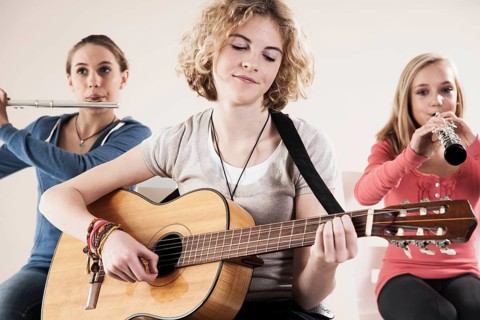 Teenagers making music together
