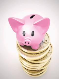 Piggy bank on a pile of euro coins