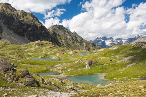Macun plateau of lakes with views of the Verstancla group with the mountains Chaputschin and Verstanclahorn