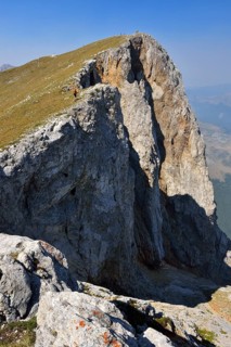 Hiker on the summit of Kom Vasojevicki Mountain