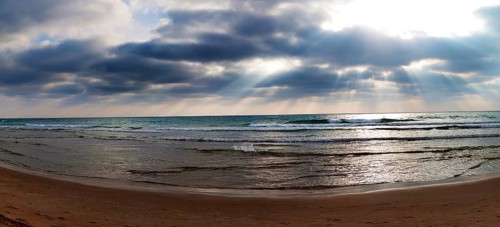 Sun rays breaking through clouds