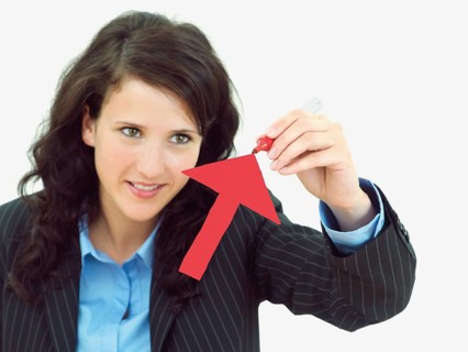Young businesswoman drawing an arrow pointing upwards