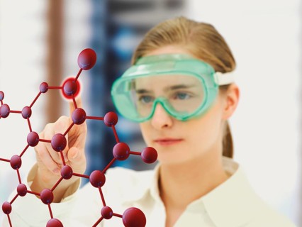 Scientist pointing to a molecule model