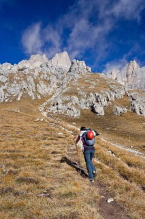 Hiker climbing Piz Boe mountain