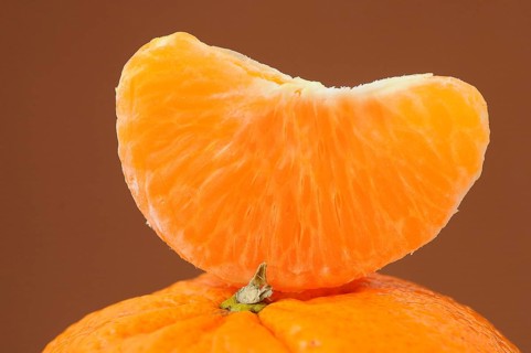 Piece of mandarine on a mandarine