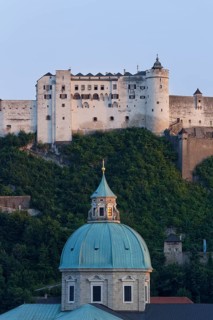 Hohensalzburg Castle and the dome of Salzburg Cathedral as seen from Kapuzinerberg mountain