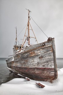 Old fishing boat in winter