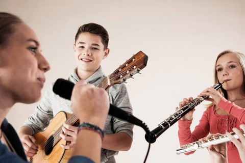 Teenagers making music together