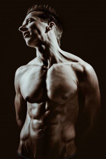 Young man with a muscular upper body