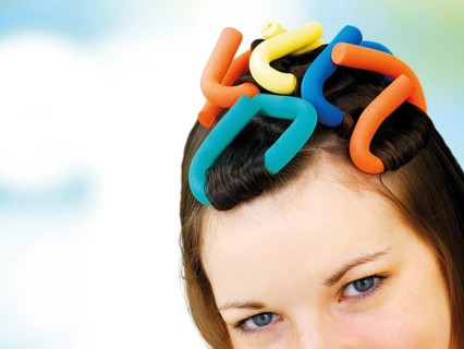 Young girl with soft-curl papillotes in her hair